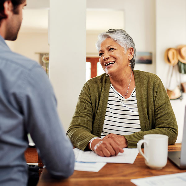 estate planning by zuber law and a happy client at a table in a meeting